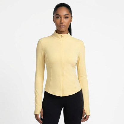 Woman wearing a beige long-sleeve top and black pants, shown from multiple angles on a white background.