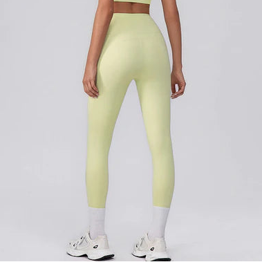 Light green leggings worn by a person on a white background