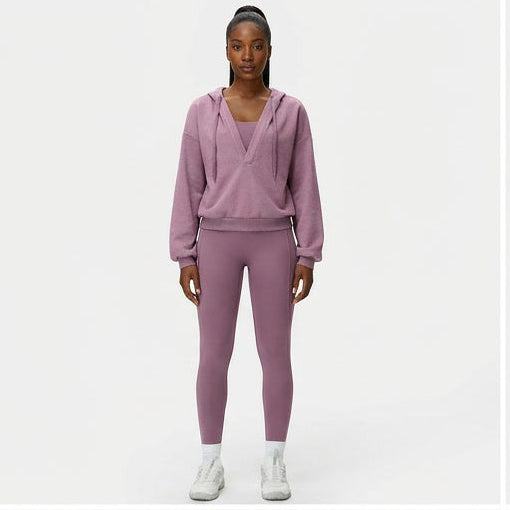 Collage of a person wearing a pink tracksuit from multiple angles on a white background.