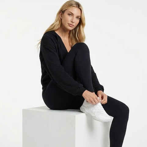 Four different women modeling a black outfit on a white background